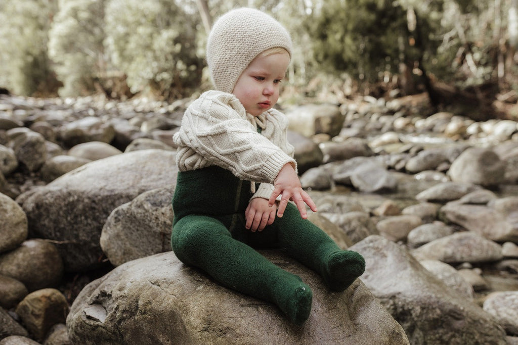 US stockist of Silly Silas' gender neutral, Teddy footed warmy tights in Dark Forest Green.