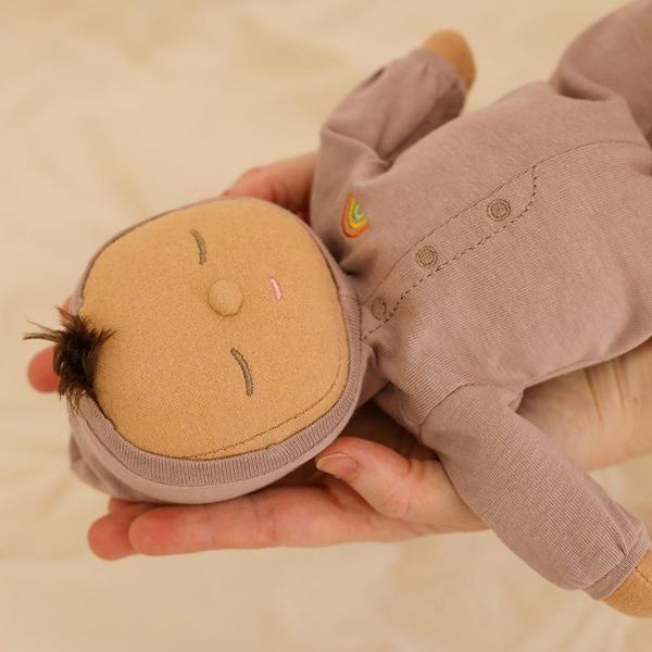 US stockist of Olli Ella's gender neutral, Pip Dozy Dinkum.  Features tuft of brown hair with non removable hooded light purple onesie.