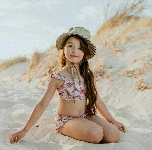 US stockist of Sukoo the Label's Harper Bikini in Dusty Floral.  Made from UPF 50 + Repreve fabric.  Crop top bikini top with ruffles at shoulder and high waisted bikini bottoms.
