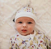 US stockist of Blossom & Gumnut's acorn bamboo tie knot beanie hat.  White with acorn print.