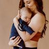 Stockist of Bonsie's rayon blend midnight blue footie.  Top section has velcro wrap body which can be undone for skin to skin contact.  Elastic waist that can be pulled down for easy diaper changes. 
