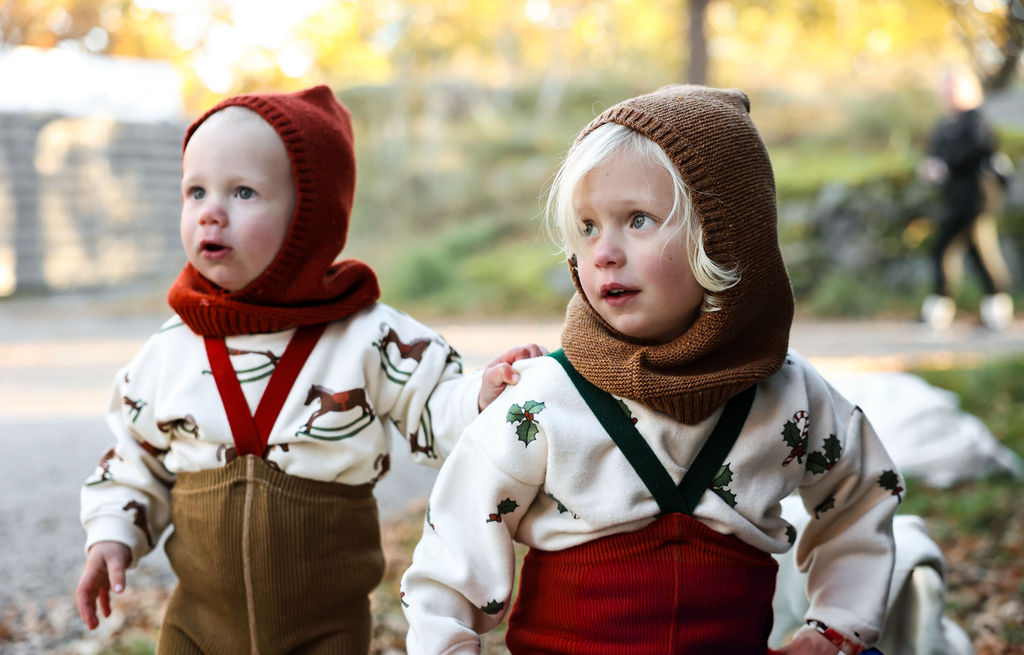 US stockist of Silly Silas' Christmas Edition footless cotton tights in Maple Leaf with Dark Forest Green braces.