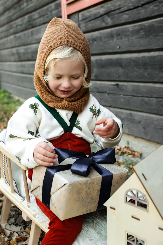 US stockist of Silly Silas' Christmas Edition footless cotton tights in Maple Leaf with Dark Forest Green braces.