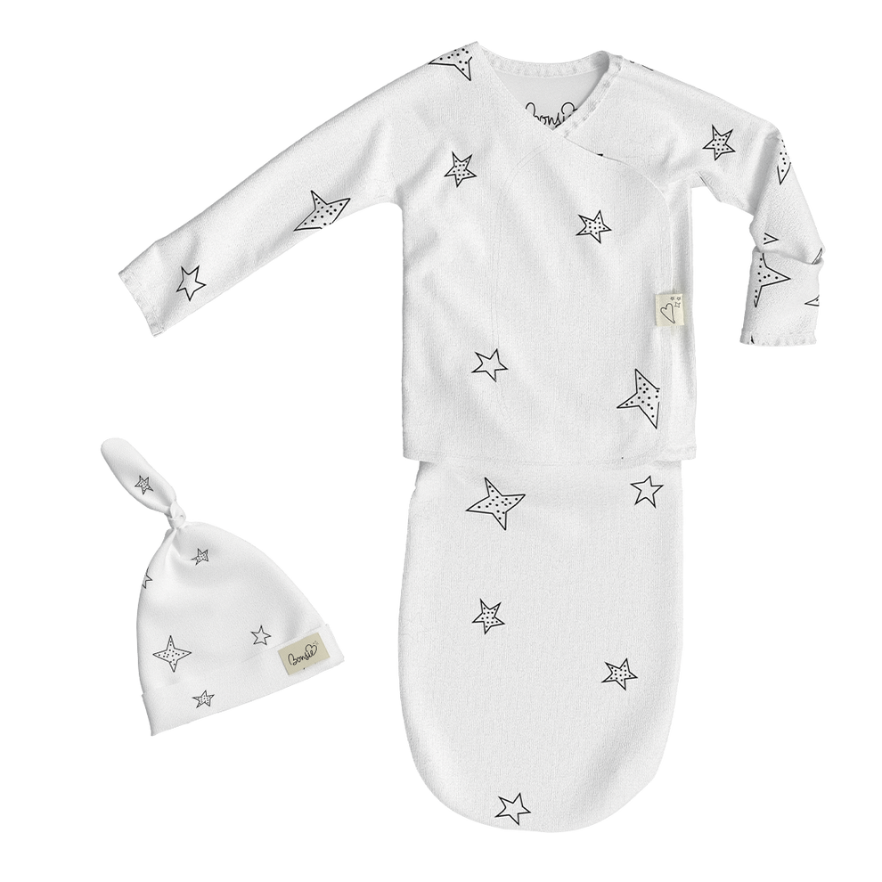 Stockist of Bonsie's rayon blend baby gown in gender neutral white fabric with star print.  Features cross over velcro top that can be undone for skin to skin.  Elastic waist which can be pulled down for easy diaper changes.
