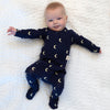 Stockist of Bonsie Babywear's Footed, dark blue "Gnight Moon" kimono style romper featuring a crescent moon print