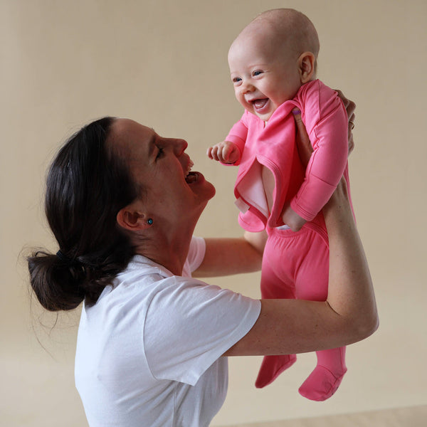 Stockist of Bonsie Babywear's Footed, vibrant "Pinky Promise" kimono style romper 