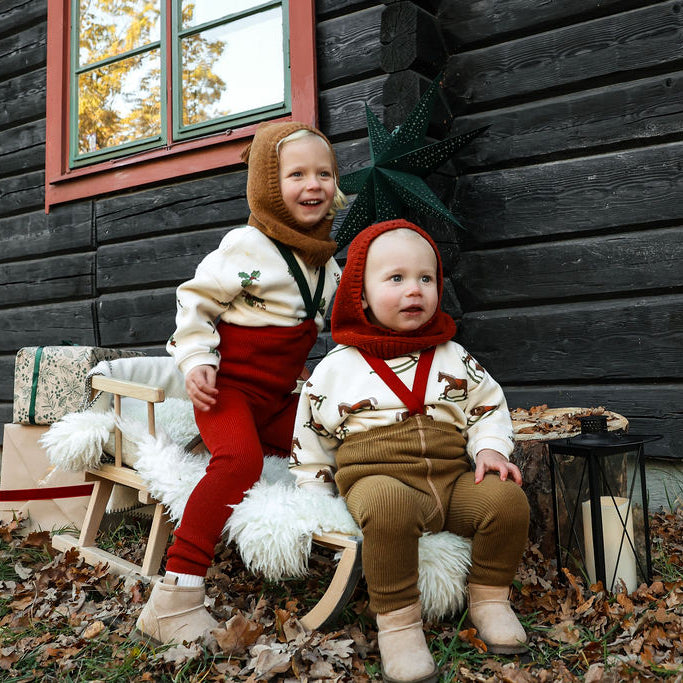 US stockist of Silly Silas' Christmas Edition footed cotton tights in Maple Leaf x Dark Forest Green braces