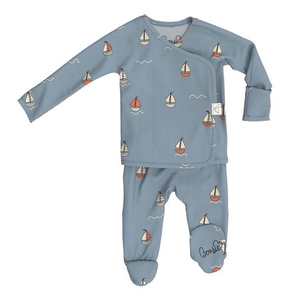 Stockist of Bonsie Babywear's Footed   "Ahoy Baby" kimono style romper featuring a print of sailboats
