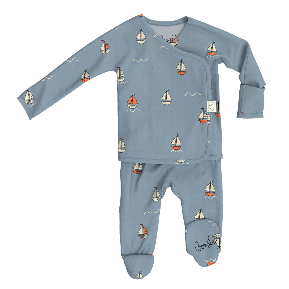 Stockist of Bonsie Babywear's Footed   "Ahoy Baby" kimono style romper featuring a print of sailboats
