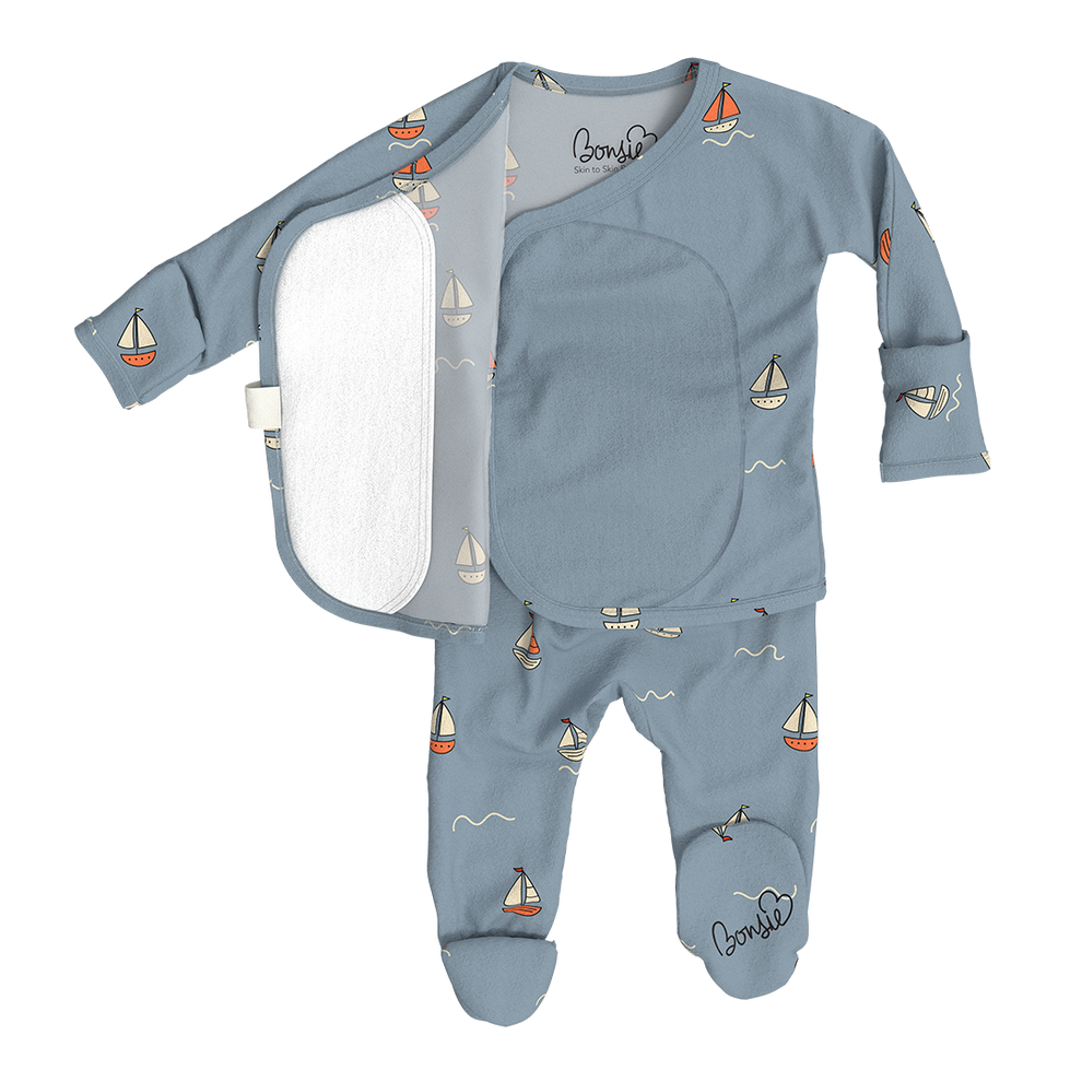Stockist of Bonsie Babywear's Footed   "Ahoy Baby" kimono style romper featuring a print of sailboats
