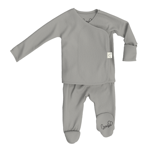 Stockist of Bonsie's rayon blend fog grey footie.  Top section has velcro wrap body which can be undone for skin to skin contact.  Elastic waist that can be pulled down for easy diaper changes. 