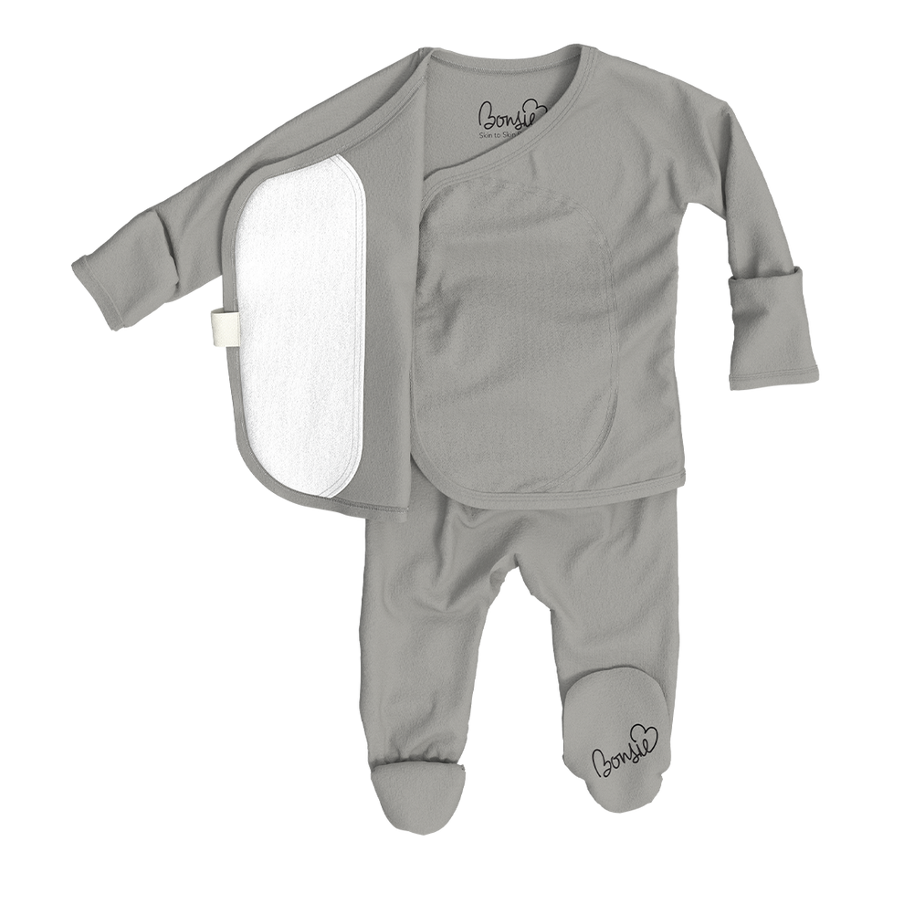 Stockist of Bonsie's rayon blend fog grey footie.  Top section has velcro wrap body which can be undone for skin to skin contact.  Elastic waist that can be pulled down for easy diaper changes. 