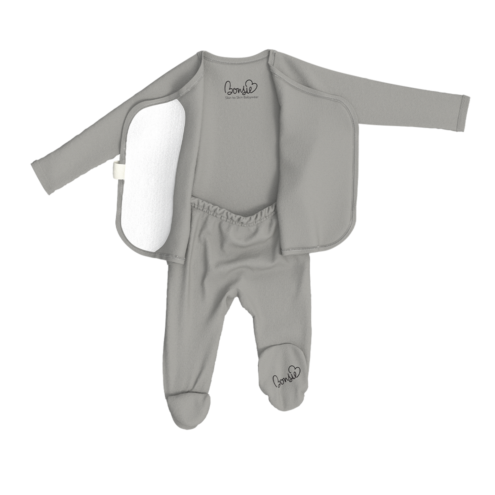 Stockist of Bonsie's rayon blend fog grey footie.  Top section has velcro wrap body which can be undone for skin to skin contact.  Elastic waist that can be pulled down for easy diaper changes. 