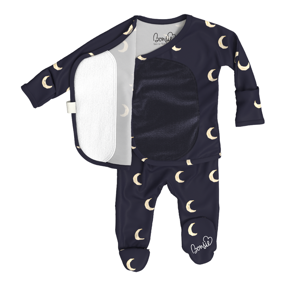 Stockist of Bonsie Babywear's Footed, dark blue "Gnight Moon" kimono style romper featuring a crescent moon print