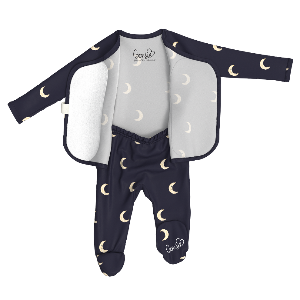 Stockist of Bonsie Babywear's Footed, dark blue "Gnight Moon" kimono style romper featuring a crescent moon print