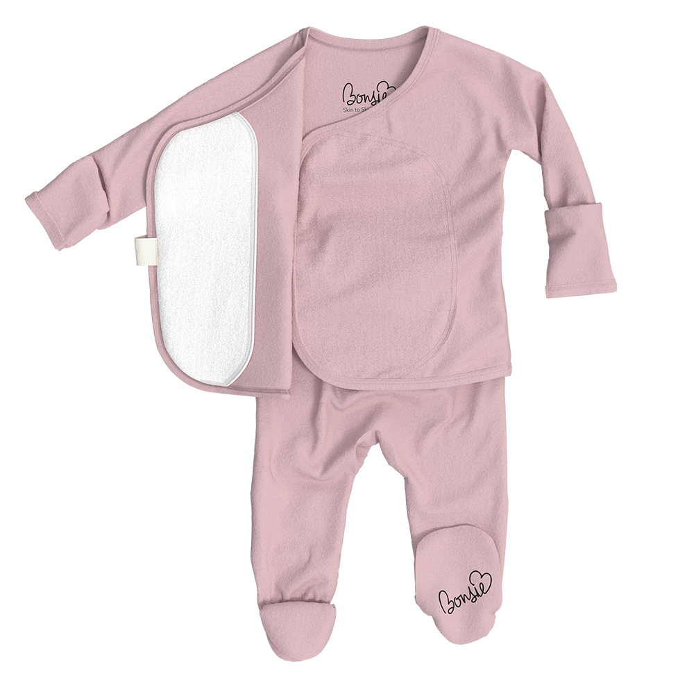 Stockist of Bonsie's rayon blend Peony pink footie.  Top section has velcro wrap body which can be undone for skin to skin contact.  Elastic waist that can be pulled down for easy diaper changes. 