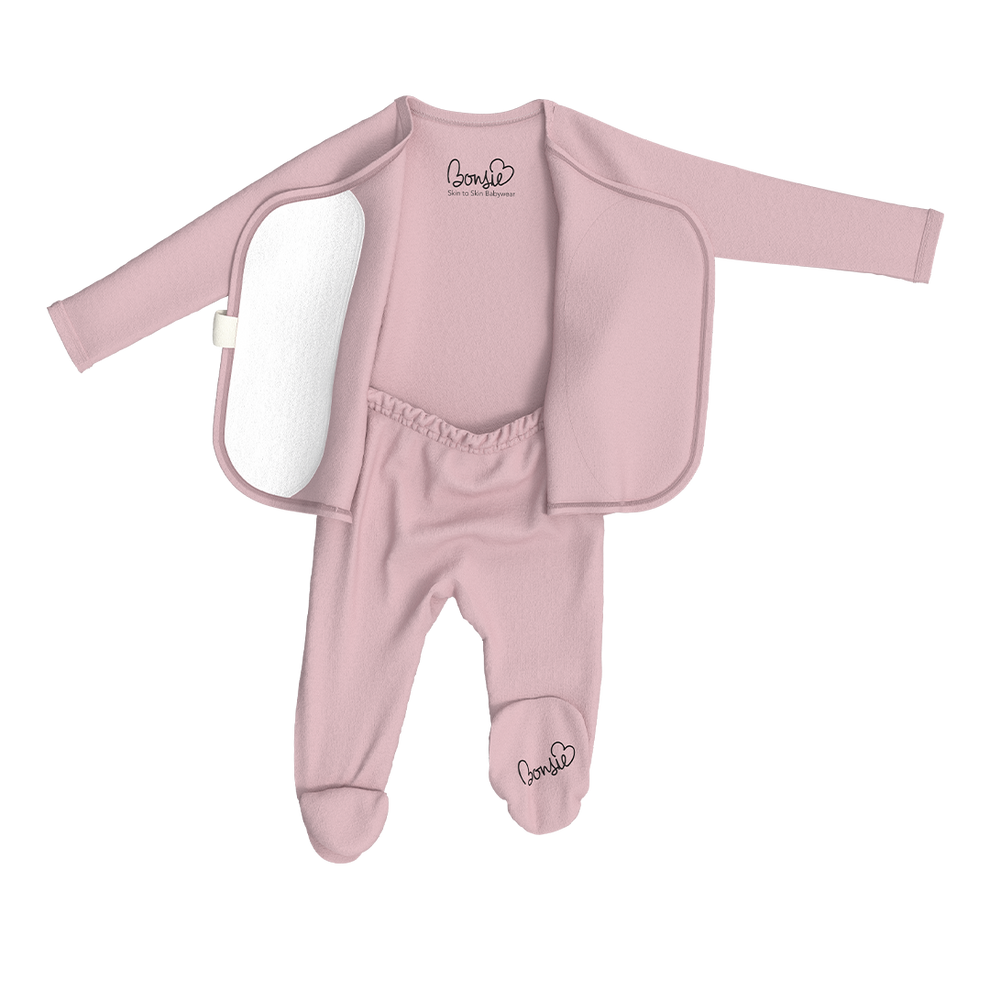 Stockist of Bonsie's rayon blend Peony pink footie.  Top section has velcro wrap body which can be undone for skin to skin contact.  Elastic waist that can be pulled down for easy diaper changes. 