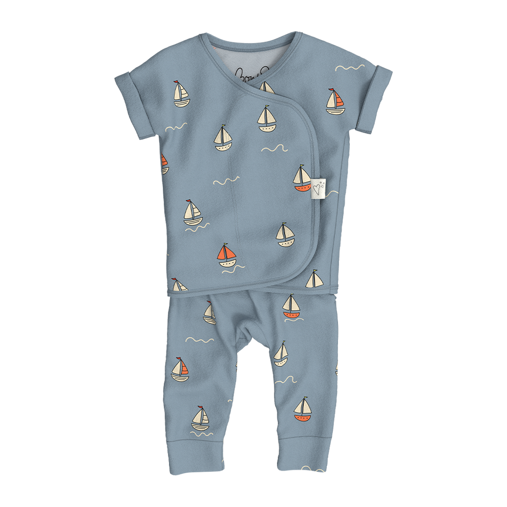 Stockist of Bonsie's Footless, sleeveless "ahoy baby" kimono romper featuring sailboat print