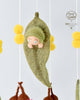 Baby mobile with hanging toys and a soft baby figure, featuring the brand 'May Gibbs'. US stockist of Tara Treasures