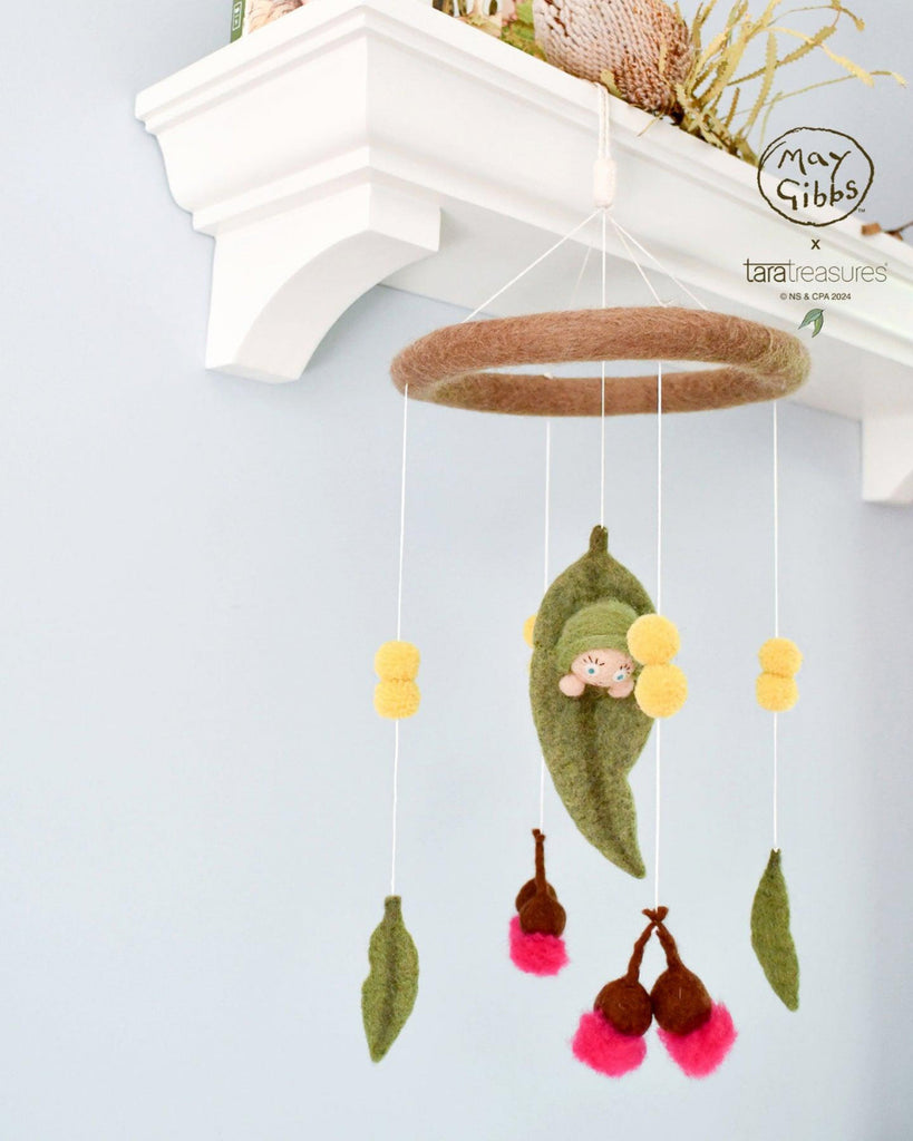 Baby mobile with hanging toys and a soft baby figure, featuring the brand 'May Gibbs'. US stockist of Tara Treasures