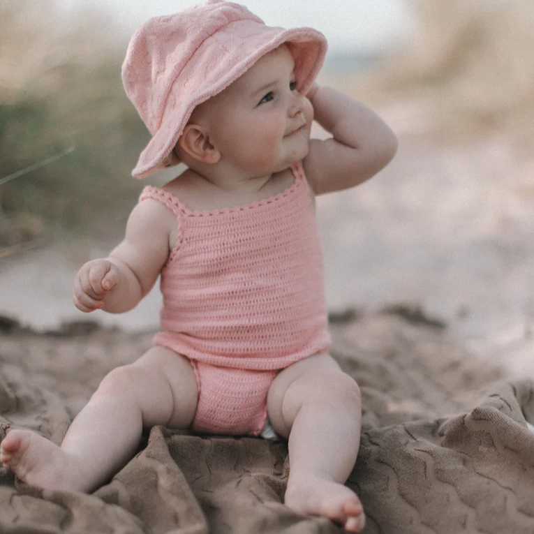 US stockist of Grown Clothing's hand crocheted romper in "Blossom"