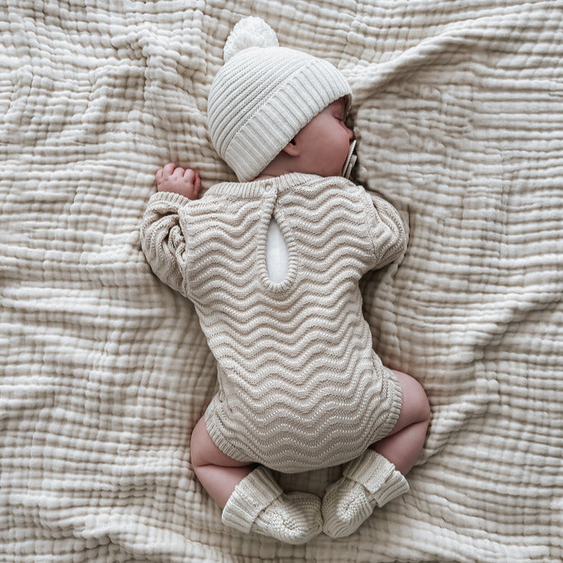 US stockist of Belle & Sun's gender neutral Wave knit romper in Almond