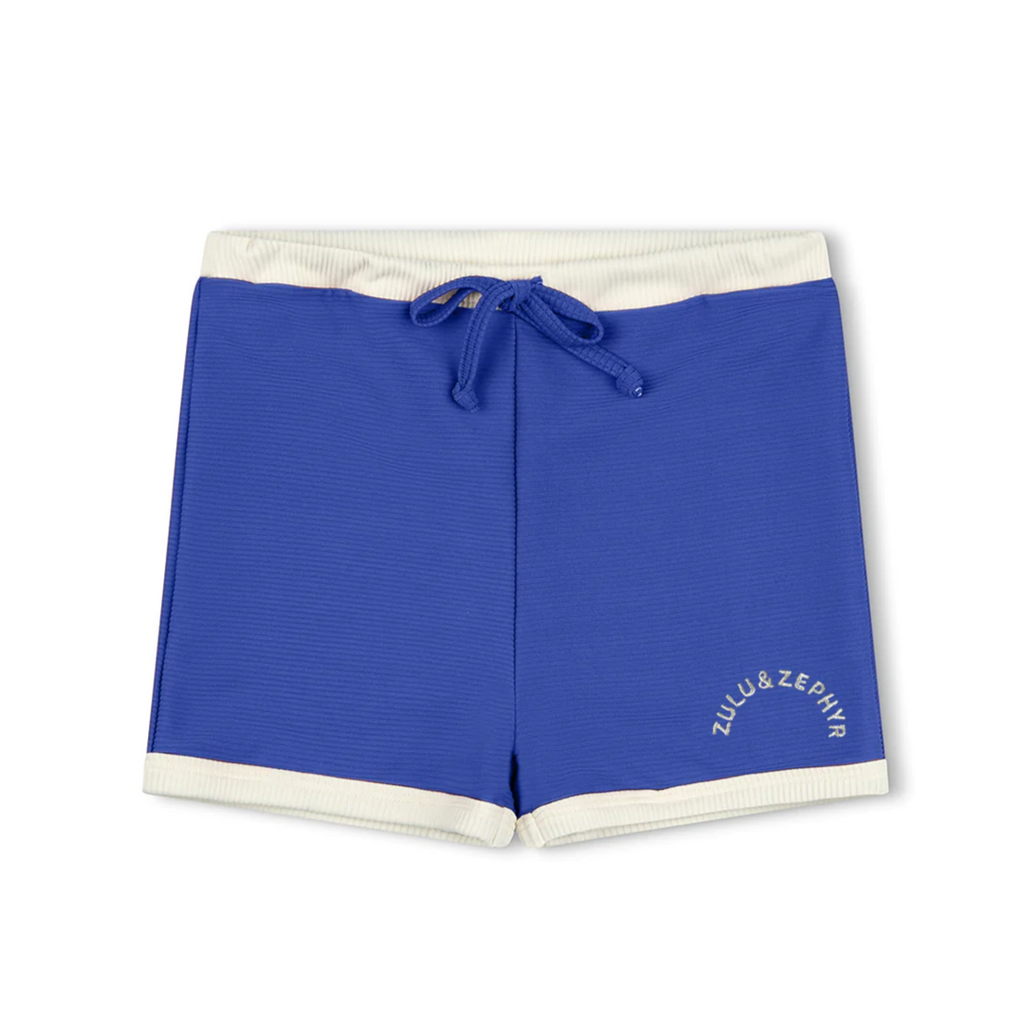 US stockist of Zulu & Zephyr's gender neutral Mini Rib Logo Surf Shorts in Deep Blue