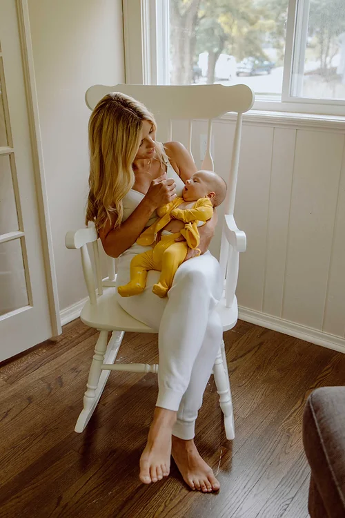Stockist of Bonsie's rayon blend Sunrise yellow footie.  Top section has velcro wrap body which can be undone for skin to skin contact.  Elastic waist that can be pulled down for easy diaper changes. 