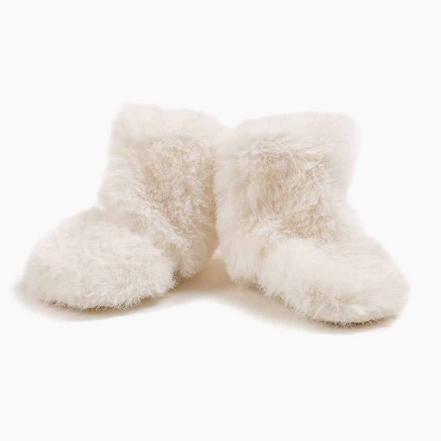 US stockist of Minikane's Ecru faux fur snow boots for dolls