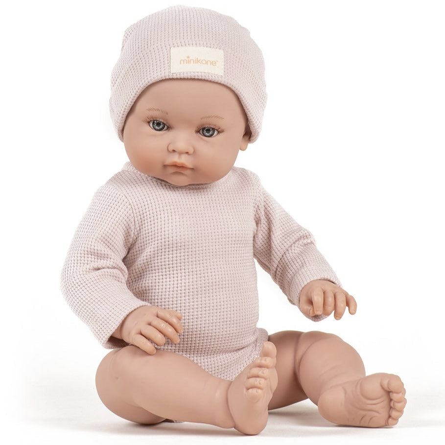 US stockist of Minikane's Bambini Andrea long sleeve bodysuit with matching hat in Petal