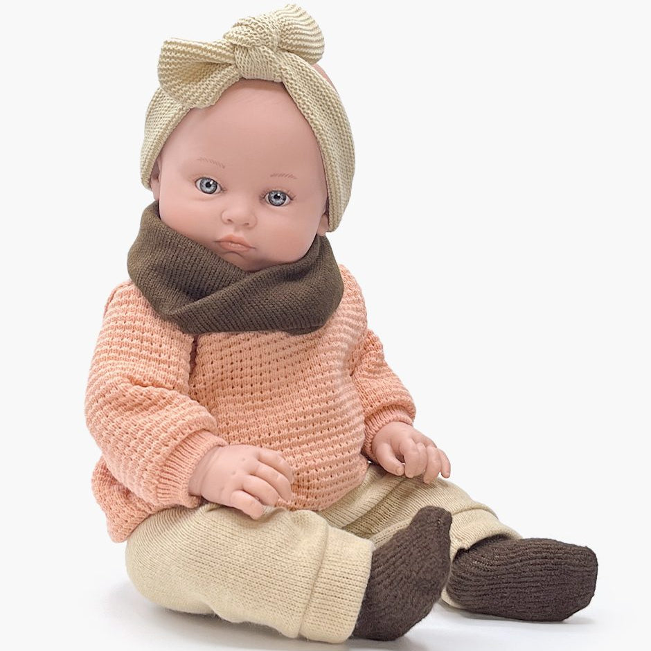 US stockist of Minikane's Yaelle Bambini doll in Pink knit sweater ensemble