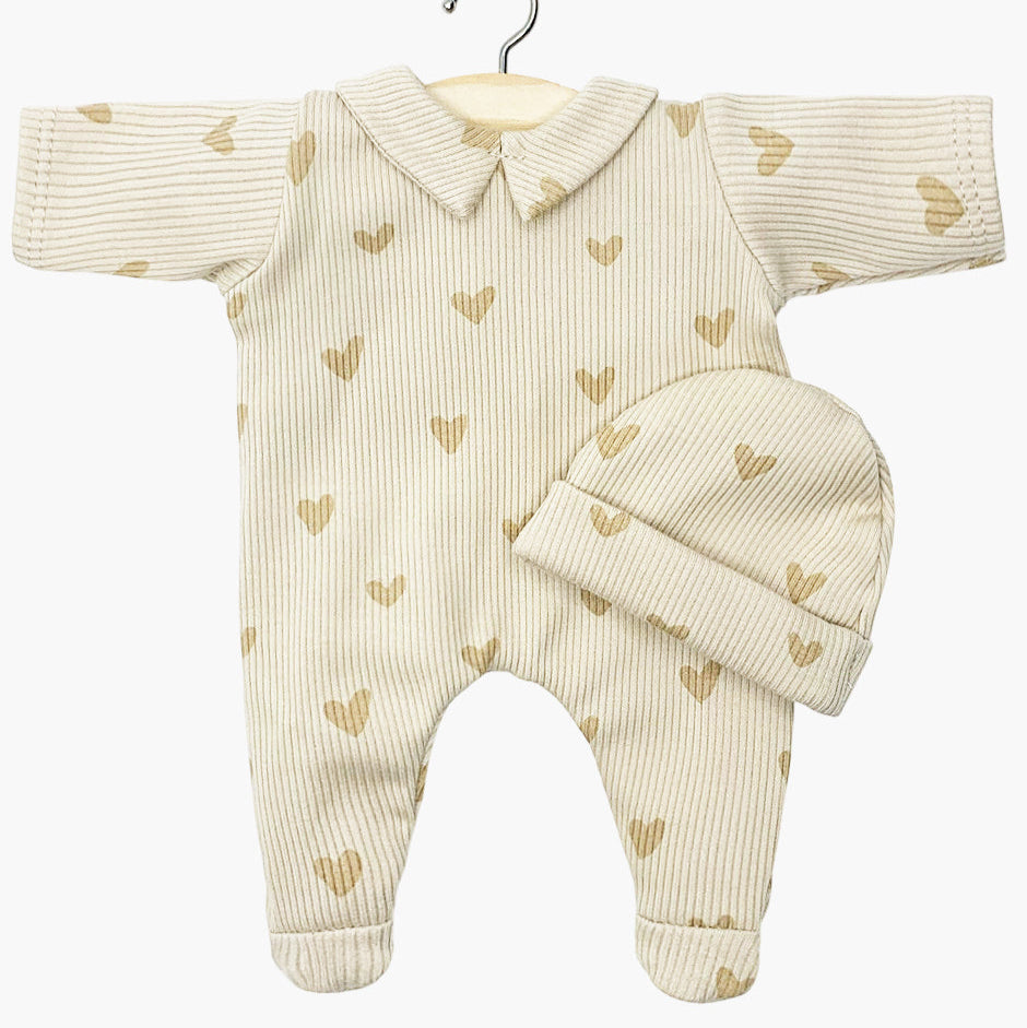 US stockist of Minikane's Babies Corentine beige sleep suit with hat in Beige Heart