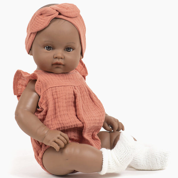 US stockist of Minikane's Augustine Bambini girl doll in her Marsala Romper with matching headband