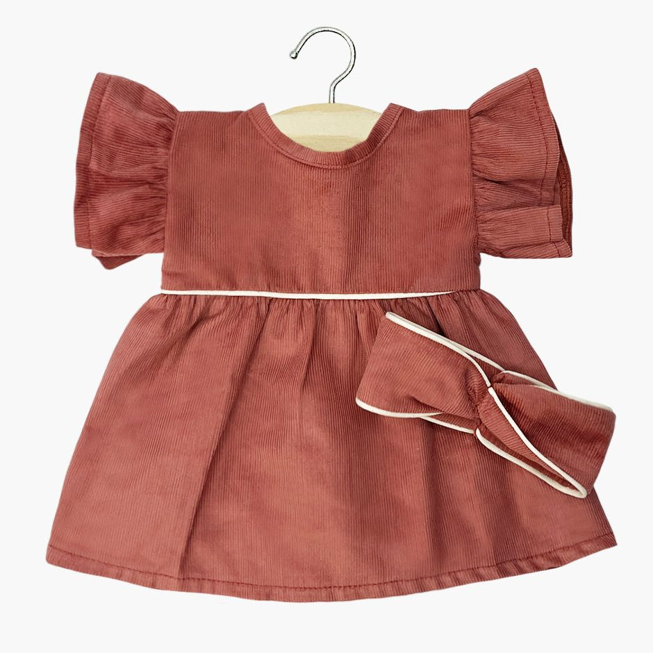 US stockist of Minikane's Daisy dress with matching twist headband in Marsala corduroy.  For bambini dolls.