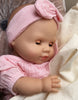 US stockist of Minikane's Emilie Sleepy doll dressed in an Eva romper with matching headband 