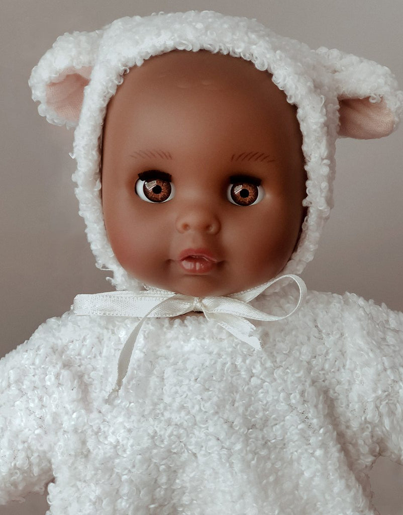 US stockist of Minikane's 10.2" Celeste Dreamy baby doll dressed in her ecru lamb outfit
