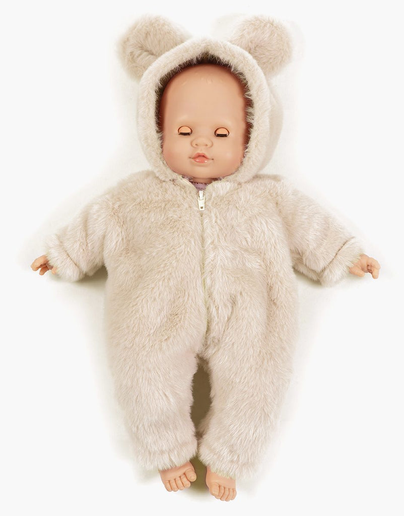 US stockist of Minikane's Emilie Sleepy Eyes Cuties doll dressed in an Ecru Winnie the Pooh jumpsuit.