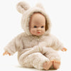 US stockist of Minikane's Emilie Sleepy Eyes Cuties doll dressed in an Ecru Winnie the Pooh jumpsuit.