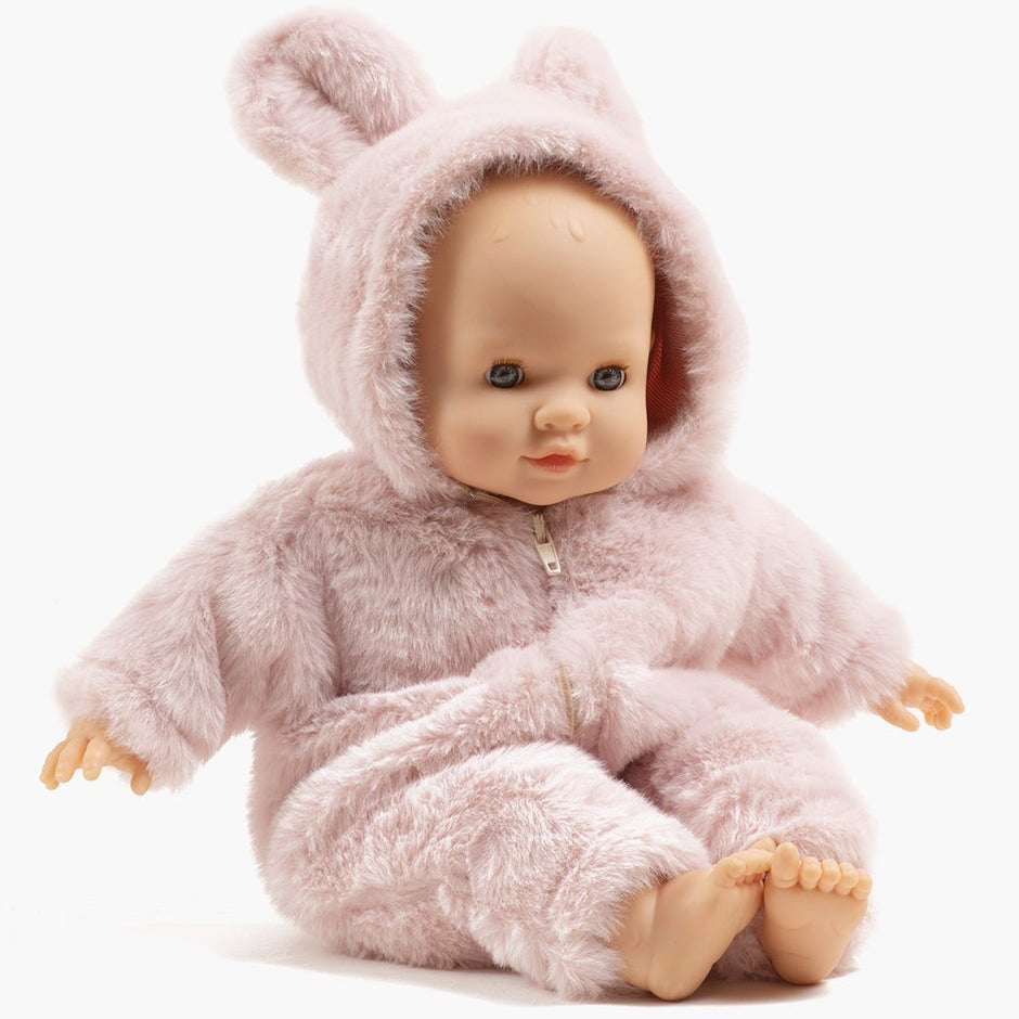 US stockist of Minikane's Emilie Sleepy Eyes Cuties doll dressed in a Pink Winnie the Pooh jumpsuit.