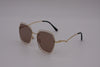 US stockist of Elle Porte's Harper sunglasses.  Features hexagon shaped brown lenses with gold frames, rated at UV 400
