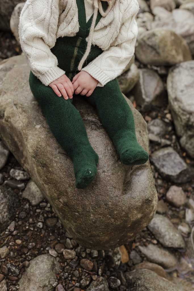 US stockist of Silly Silas' gender neutral, Teddy footed warmy tights in Dark Forest Green.