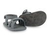 US stockist of Donsje USA's Giggles premium handmade leather nubuck sandals.  Petrol Grey in color with velcro fastening at back.  Sizes 0-12 mths have soft sole, 12-30mths have a soft flexible, rubber sole.