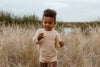 US stockist of Grown Clothing's gender neutral chunky knit rib bloomers in tan. Made from 100% cotton with an elastic waistband and two mock wooden buttons.
