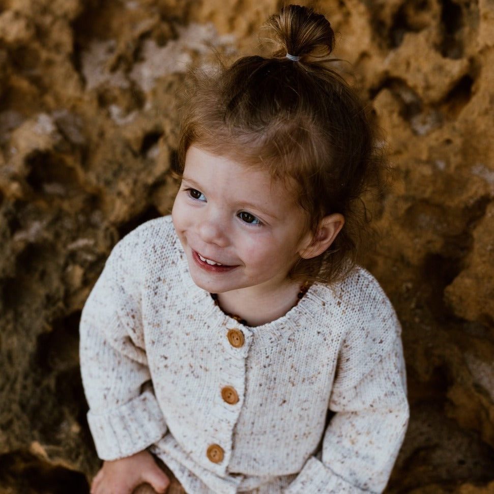 US stockist of Grown Clothing's gender neutral, Funfetti Speckle Cardigan in Sand.  made from 100% cotton.
