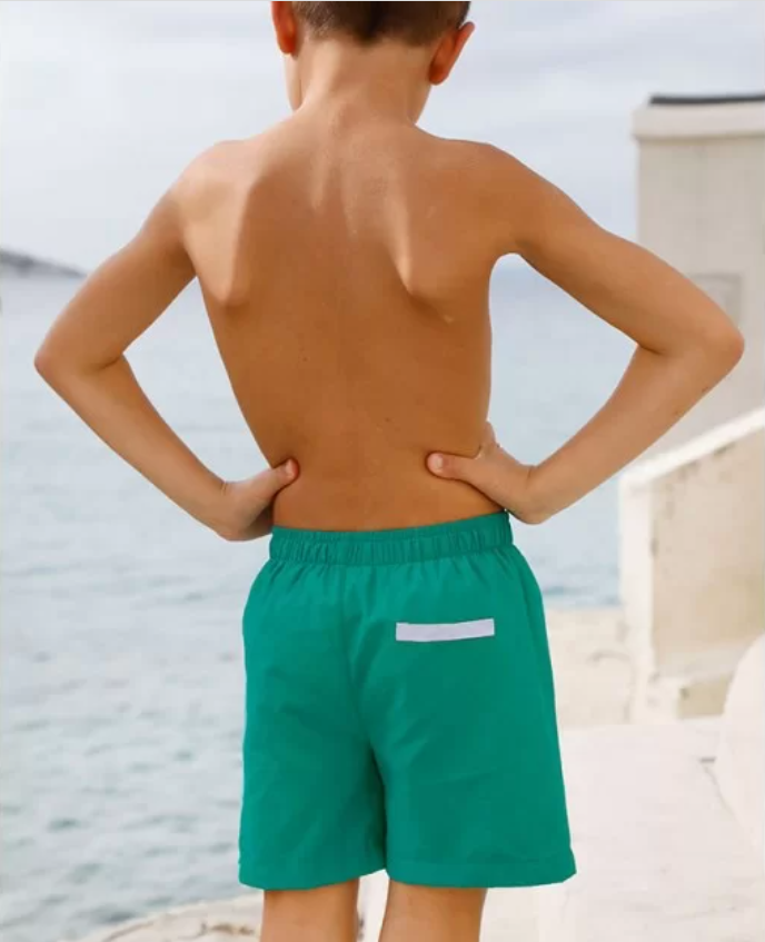 US stockist of Canopea's quick dry Diego swim short in Baleares Green.