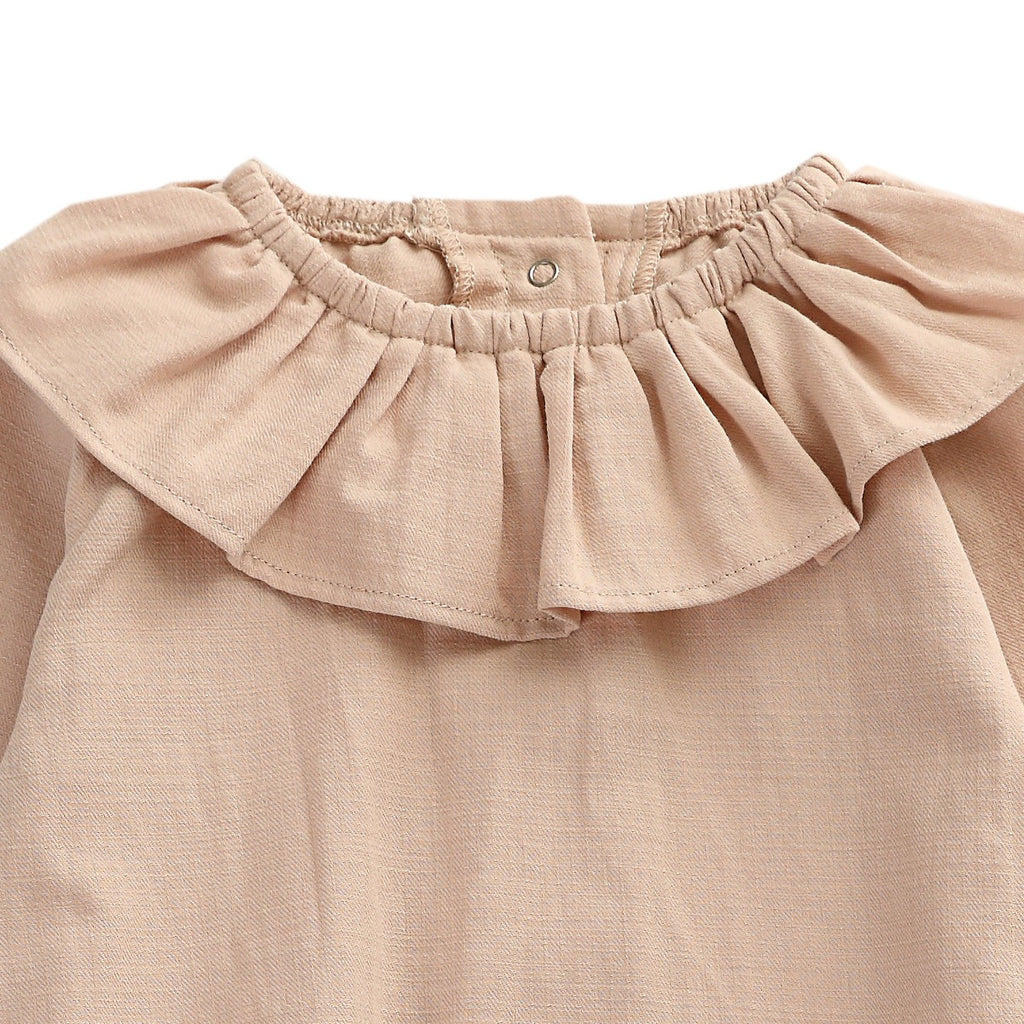 US stockist of Donsje's long sleeve chloe bodysuit in Crystal Pink.  Made from cotton with a ruffle neck.