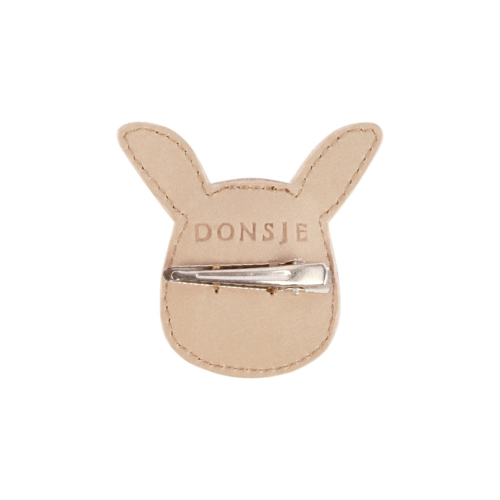 US stockist of Donsje's Josy Bunny hair clip. Handmade from premium pink leather with a snap hair clip.