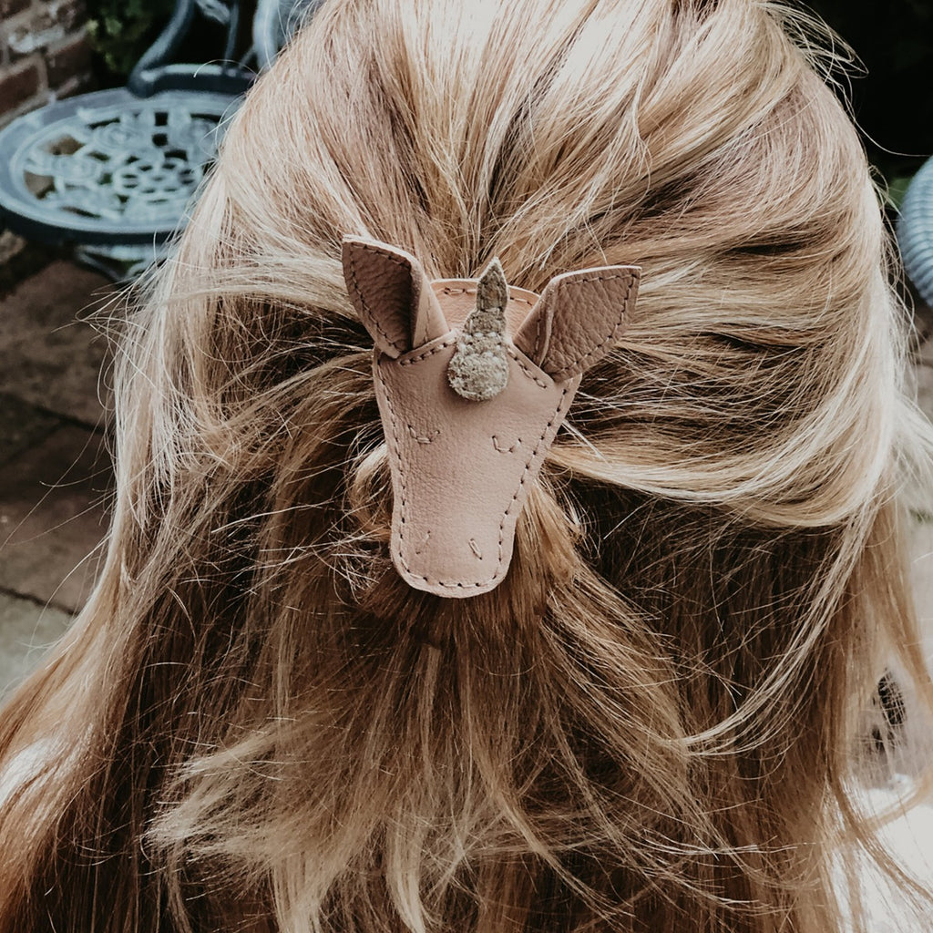US stockist of Donsje's Josy Unicorn hair clip. Handmade from premium pink leather with a snap hair clip.