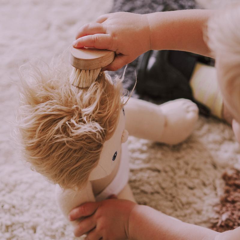 US stockist of Dinkum Doll hairbrush made from unbleached pine wood and with wool bristles.