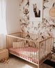 US stockist of Snuggle Hunny Kid's Daisy stretch cotton jersey crib sheet. Dusky pink color with white daisy print.